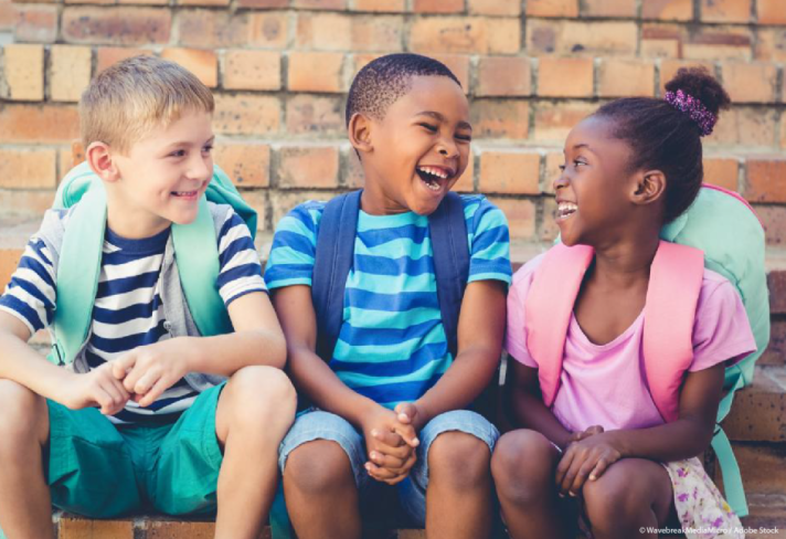 mixed raced children laughing