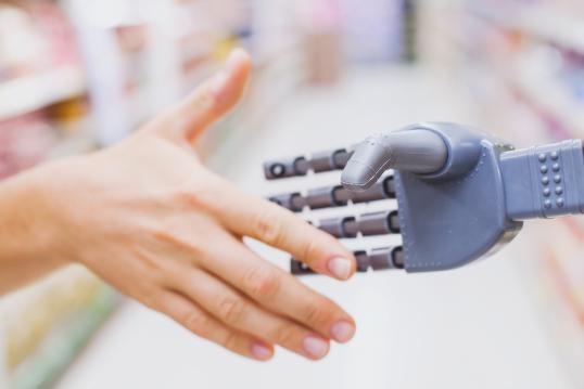 Human shaking hands with a robot