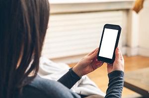 woman holding her phone