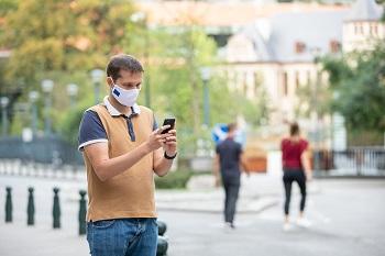 man looking at smartphone in EU