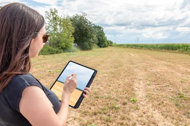 A woman using a tablet for effective farm management