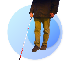 a man carrying a white cane