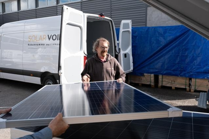 A 44-year-old man installing solar panels