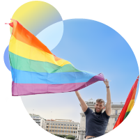 A person holding a rainbow flag