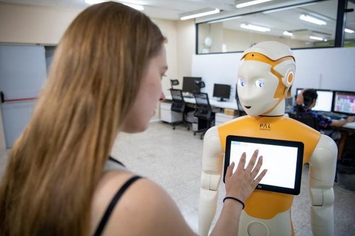 A "ARI V2" robot manipulated by an engineer