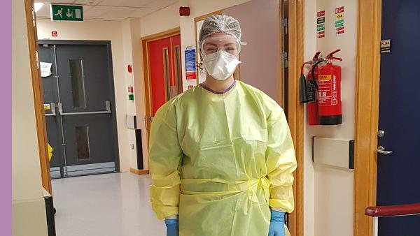 Renata in the hospital in full protective gear