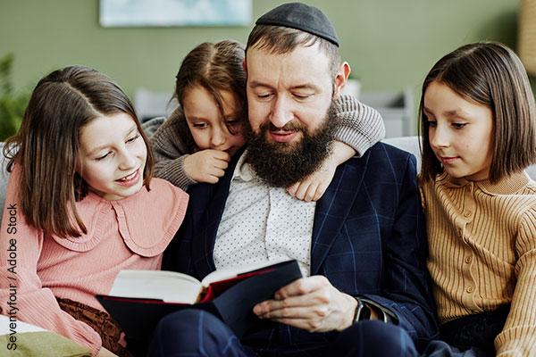 Jewish family reading a book