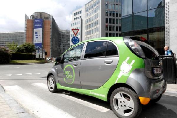 an electric car in front of a European Commission building