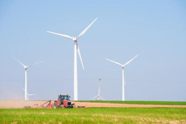 Denmark - Tractor with wind turbine in the background