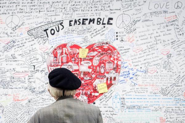 Man looks at Belgium attacks metro memorial